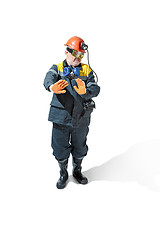 Image showing The studio shot of senior bearded male miner standing at the camera on a white background.