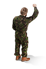 Image showing Young army soldier wearing camouflage uniform isolated on white