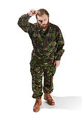 Image showing Young army soldier wearing camouflage uniform isolated on white