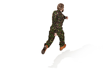 Image showing Young army soldier wearing camouflage uniform isolated on white