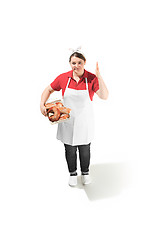 Image showing Portrait of cute smiling woman with pastries in her hands in the studio, isolated on white background