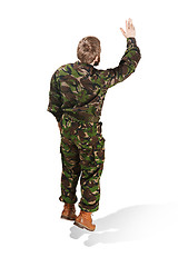 Image showing Young army soldier wearing camouflage uniform isolated on white