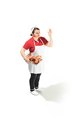 Image showing Portrait of cute smiling woman with pastries in her hands in the studio, isolated on white background