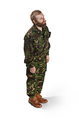 Image showing Young army soldier wearing camouflage uniform isolated on white