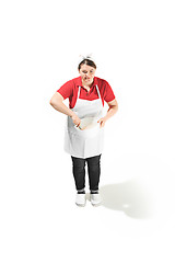 Image showing Portrait of cute smiling woman with bowl in her hands in the studio, isolated on white background