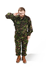 Image showing Young army soldier wearing camouflage uniform isolated on white