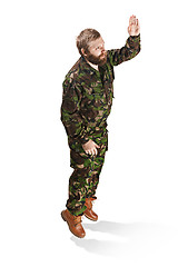 Image showing Young army soldier wearing camouflage uniform isolated on white