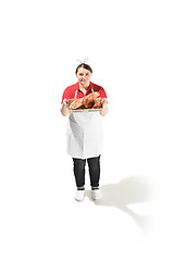 Image showing Portrait of cute smiling woman with pastries in her hands in the studio, isolated on white background