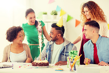 Image showing office team greeting colleague at birthday party