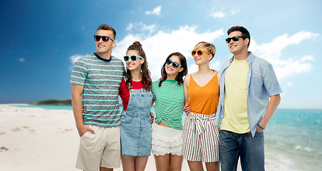 Image showing friends in sunglasses over tropical beach