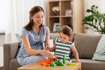 Image showing pregnant mother and daughter with toy blocks