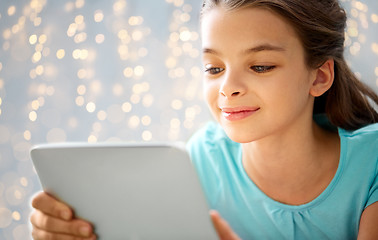 Image showing close up of smiling girl with tablet pc