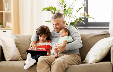 Image showing happy father with preteen and baby son at home