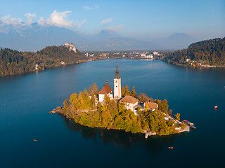 Image showing Aerial view of Bled island on lake Bled, and Bled castle and mountains in background, Slovenia.