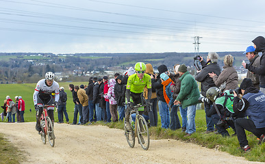 Image showing Two Cyclists on a Dirty Road - Paris-Nice 2016