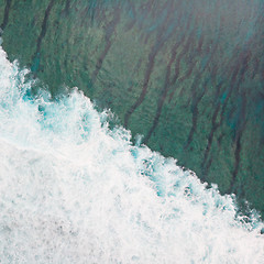 Image showing Aerial shot of the braking wave in the ocean.