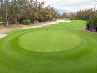 Image showing Golf course hole green and sand traps.