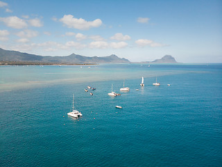 Image showing Top down aerial view of boats on the reef of tropical beach of Black River, Mauritius island