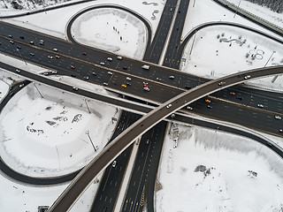 Image showing Aerial view of a freeway intersection Snow-covered in winter.