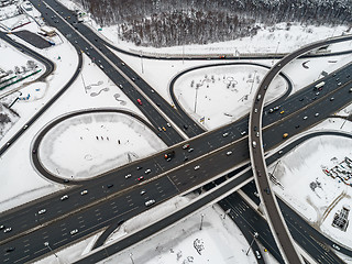 Image showing Aerial view of a freeway intersection Snow-covered in winter.