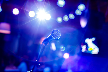 Image showing Microphone on stage against a background of auditorium.