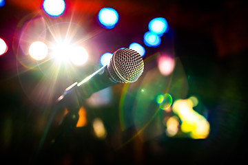 Image showing Microphone on stage against a background of auditorium.