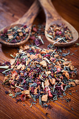 Image showing Assorted dry tea on wooden background