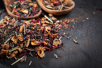 Image showing Assorted dry tea on wooden background