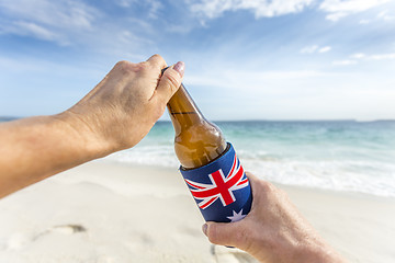 Image showing Beach party holiday mode, open a cold beer on beach
