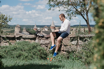 Image showing Man using a modern portable computer on the park