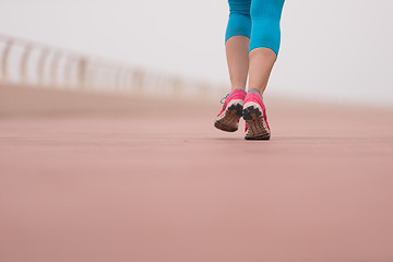 Image showing woman busy running on the promenade