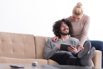 Image showing couple relaxing at  home with tablet computers