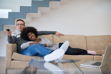 Image showing multiethnic couple relaxing at home