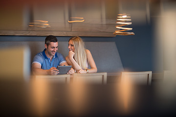 Image showing couple using tablet at home