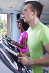 Image showing people exercisinng a cardio on treadmill