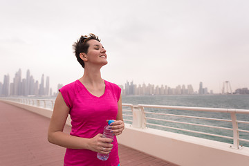 Image showing young woman celebrating a successful training run