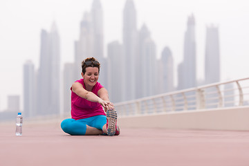 Image showing woman stretching and warming up