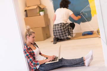 Image showing Happy couple doing home renovations