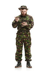 Image showing Young army soldier wearing camouflage uniform isolated on white