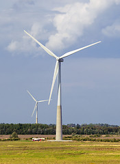 Image showing Wind generators in a field