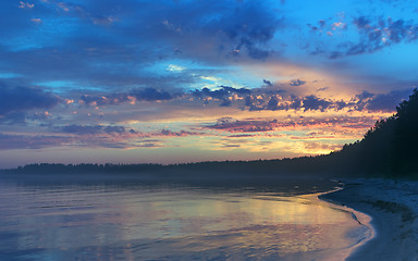 Image showing Amazing Sunset Over The Forested Shore Of The Northern Lake