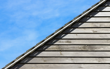 Image showing Old Wood Planks Texture Under The Roof And Natural Sky Backgroun