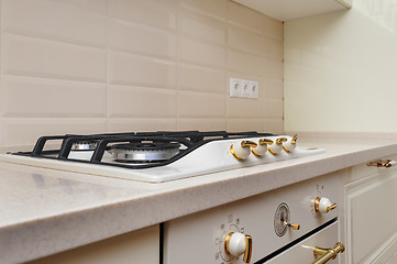 Image showing Gas stove and oven at cream colored kitchen