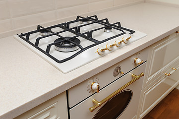 Image showing Gas stove and oven at cream colored kitchen