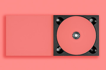 Image showing pastel pink cd in case on pastel pink background.