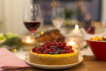 Image showing cake and other food on christmas table at home