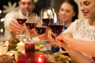 Image showing close up of friends with wine celebrate christmas