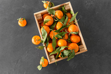 Image showing close up of mandarins on slate table top