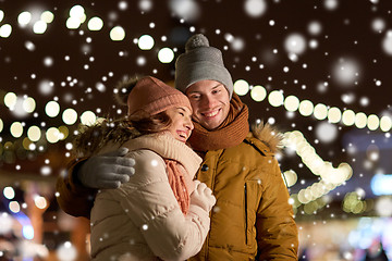 Image showing happy couple hugging at christmas tree