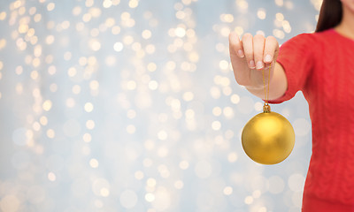 Image showing close up of woman in sweater with christmas ball